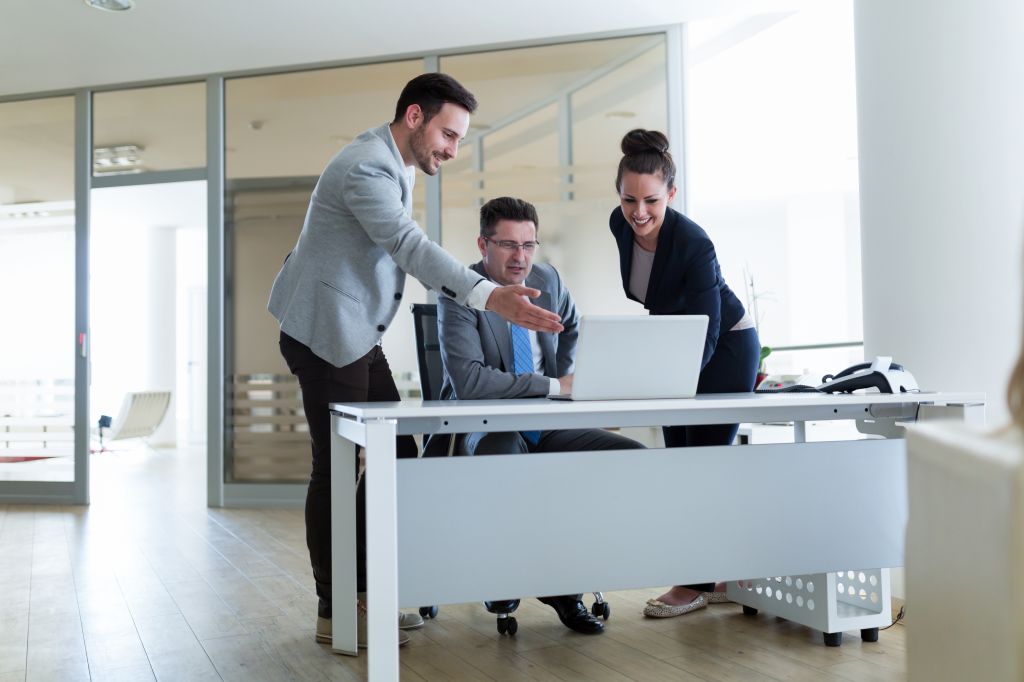 Picture of sales agents working together in company office